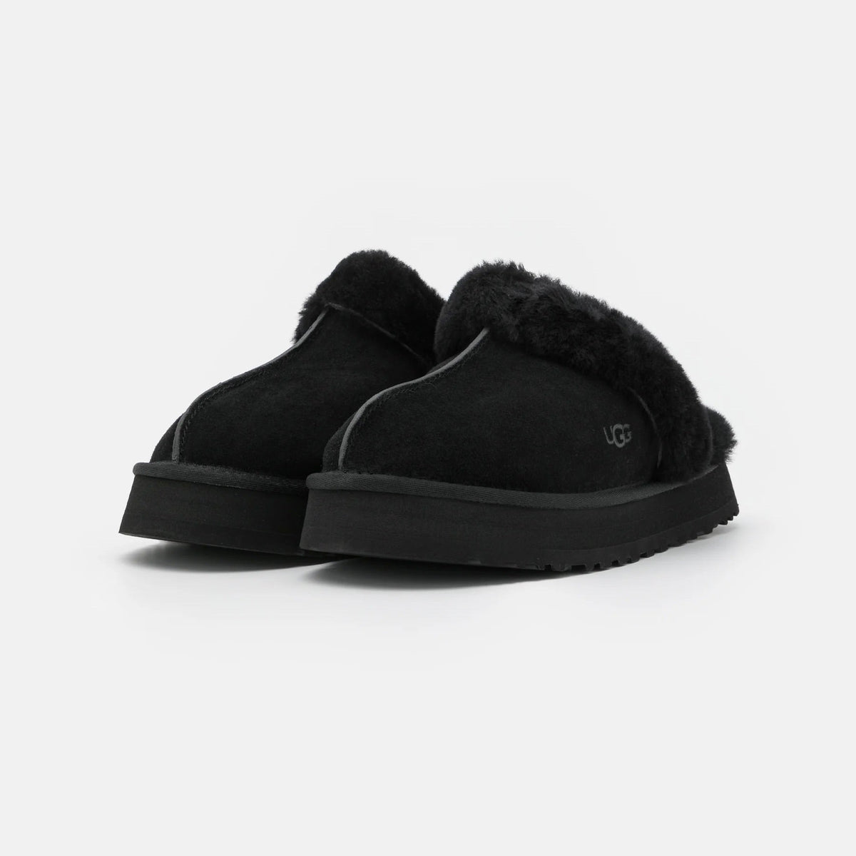 UGG Disquette Black sabots fourrés femme en daim et peau de mouton noir, détail semelle