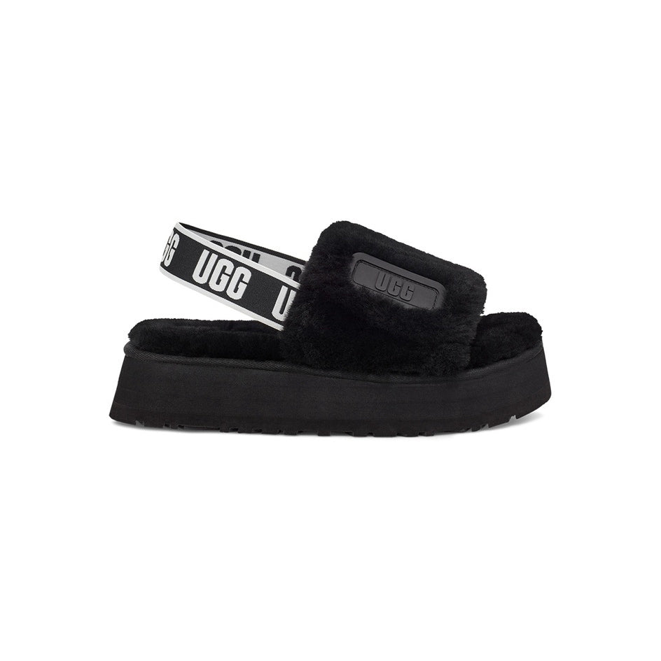 UGG Disco Slide Black claquettes fourrées femme en peau de mouton naturelle noir, vue de profil