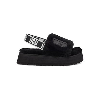 UGG Disco Slide Black claquettes fourrées femme en peau de mouton naturelle noir, vue de profil