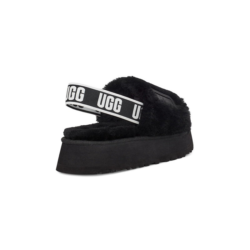 UGG Disco Slide Black claquettes fourrées femme en peau de mouton naturelle noir, détail semelle