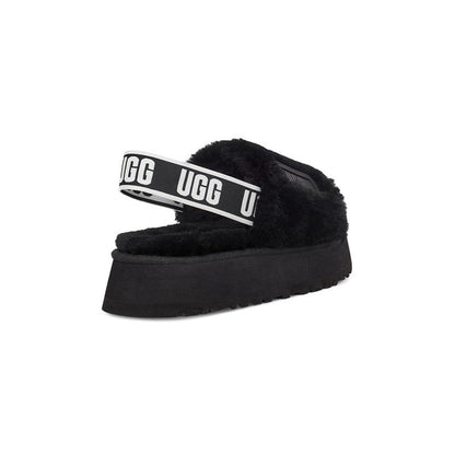 UGG Disco Slide Black claquettes fourrées femme en peau de mouton naturelle noir, détail semelle