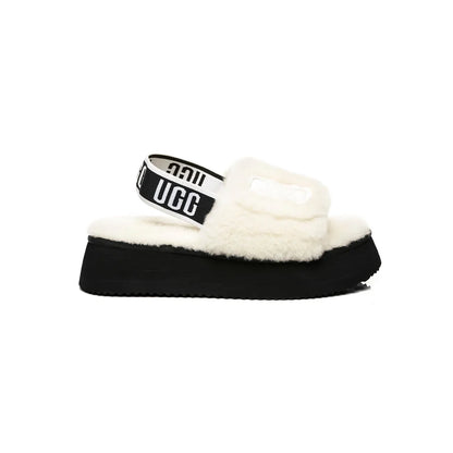 UGG Disco Slide White Black claquettes fourrées femme en peau de mouton naturelle blanc et noir, vue de profil